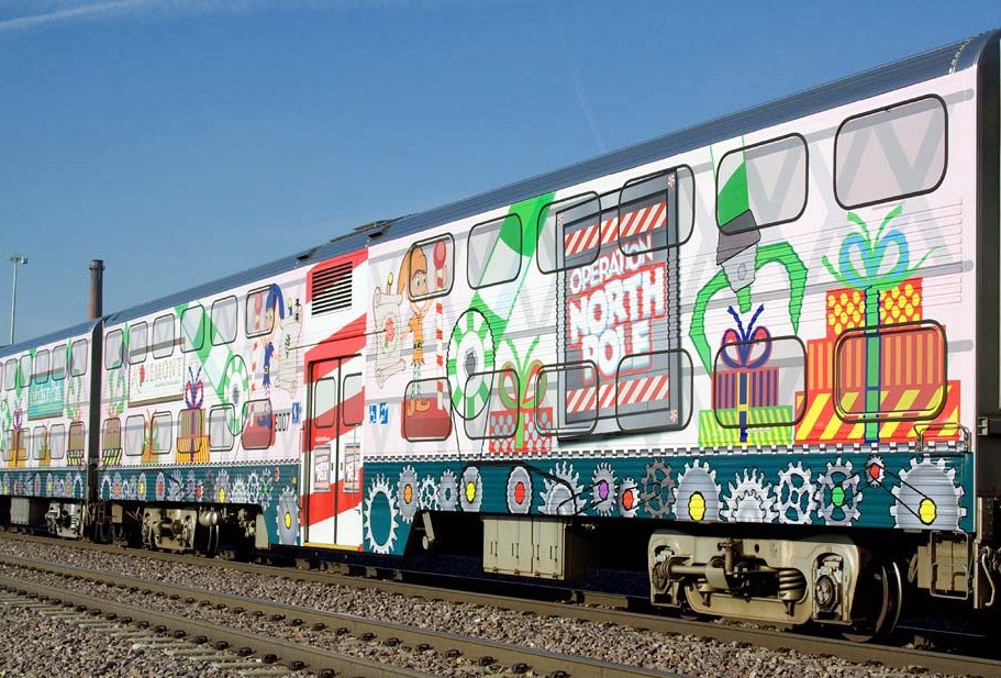 The colorful Operation North Pole train decorated with presents and characters